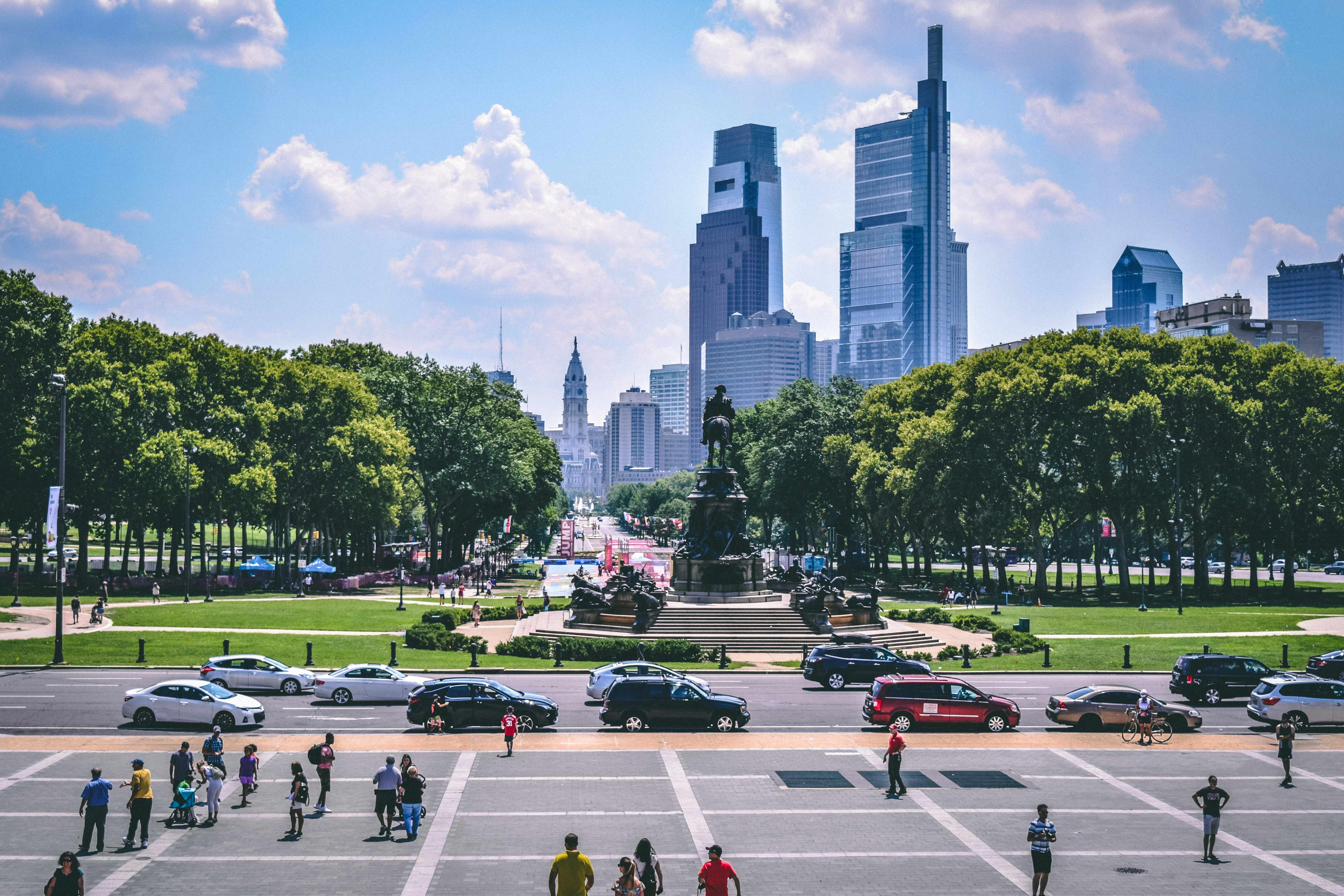Philadelphia seen down the Benjamin Franklin Parkway, with the fountain at Eakins Oval, City Hall tower, and the Center City skyline